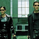 Trinity and Neo storming a building.